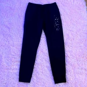 Black sweatpants. Black and white tie dye   M &Ms name on the side